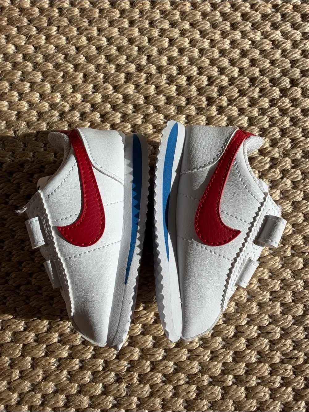 Nike White Baby Sneakers with Red Swoosh and Blue Accent size 4c